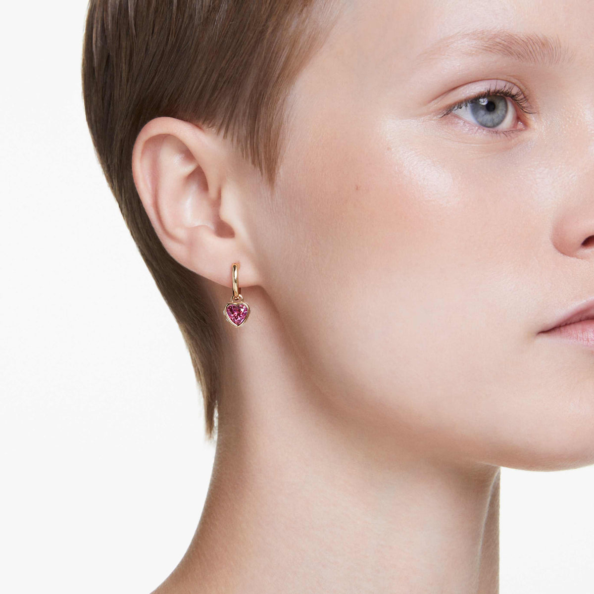 Swarovski Chroma drop earrings featuring a heart motif with pink accents and rhodium plating