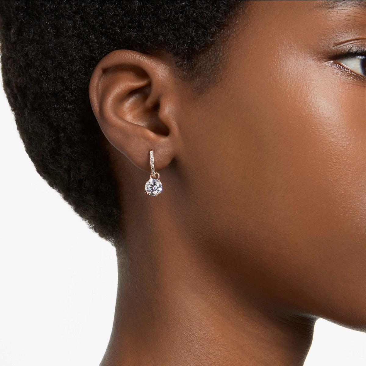Swarovski Stilla drop earrings with white round-cut accents and an 18K gold finish