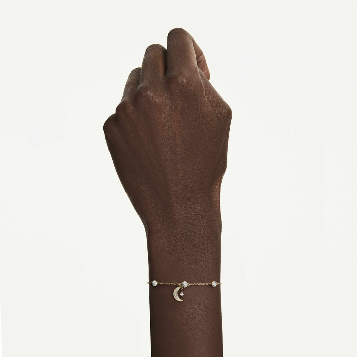 Swarovski Symbolica bracelet featuring a moon motif with blue round-cut accents and rhodium plating