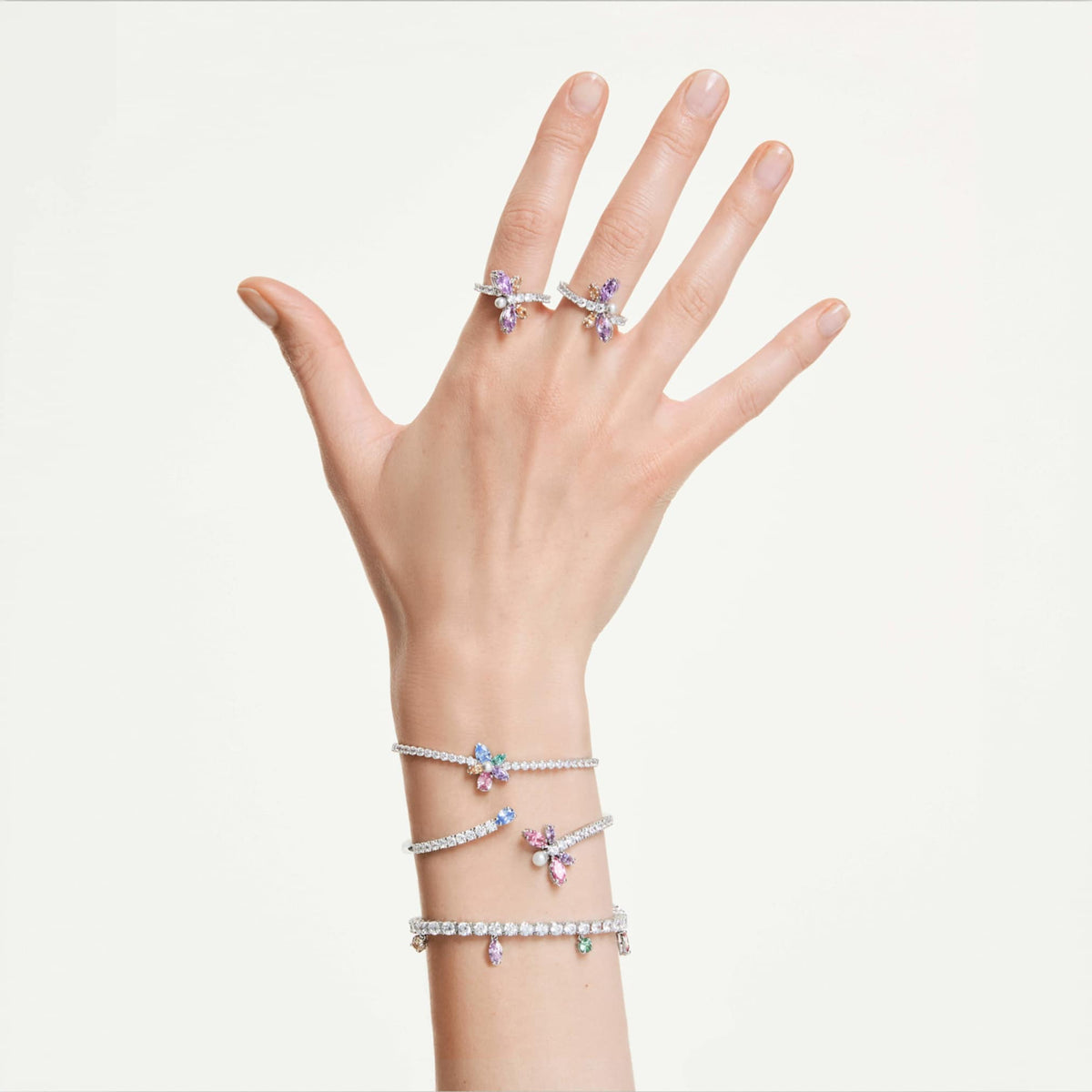 Ariana Grande x Swarovski bangle featuring a dragonfly motif with multicolored mixed-cut accents and rhodium plating