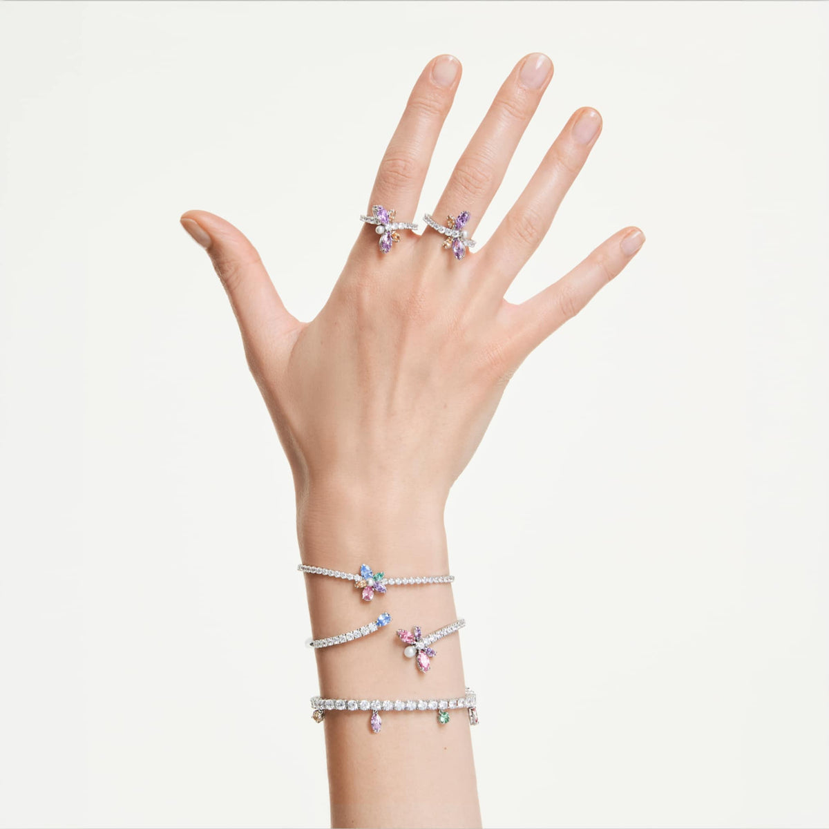 Ariana Grande x Swarovski motif ring featuring a dragonfly motif with multicolored mixed-cut accents and rhodium plating