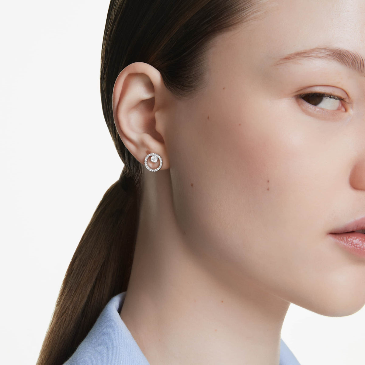 Swarovski Constella stud earrings with white round-cut accents and an 18K rose gold finish