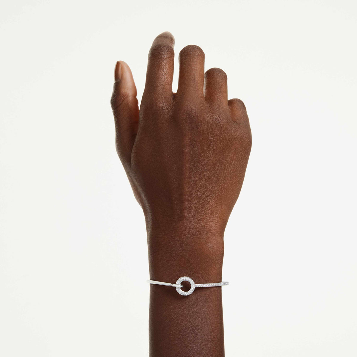 Swarovski Dextera bangle with white round-cut accents and an 18K gold finish