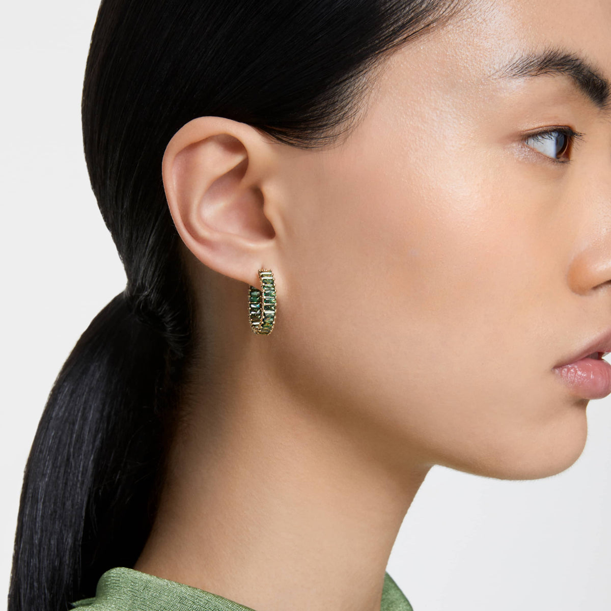 Swarovski Matrix hoop earrings with pink baguette-cut accents and an 18K rose gold finish