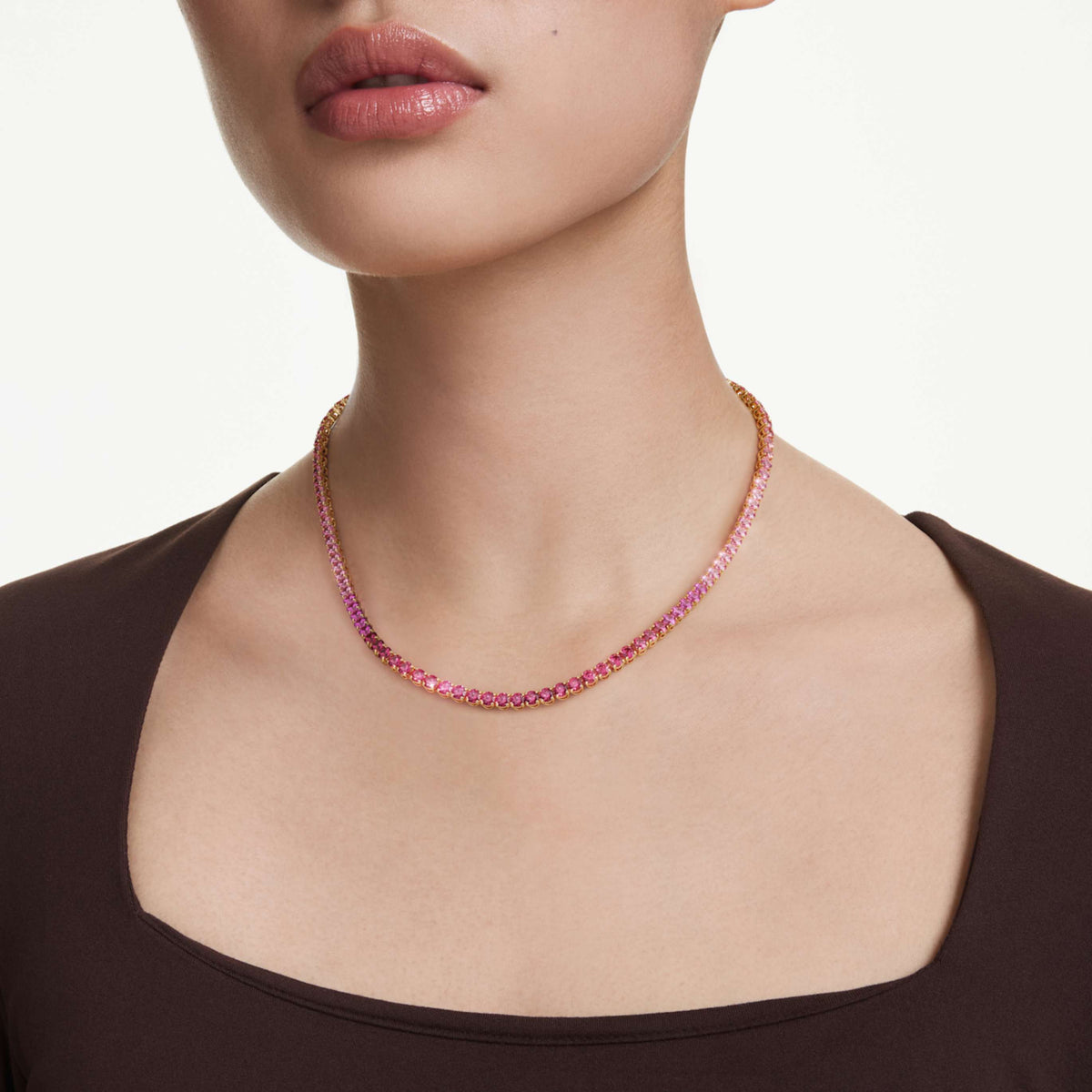 Swarovski Matrix Tennis necklace with white round-cut accents and an 18K gold finish