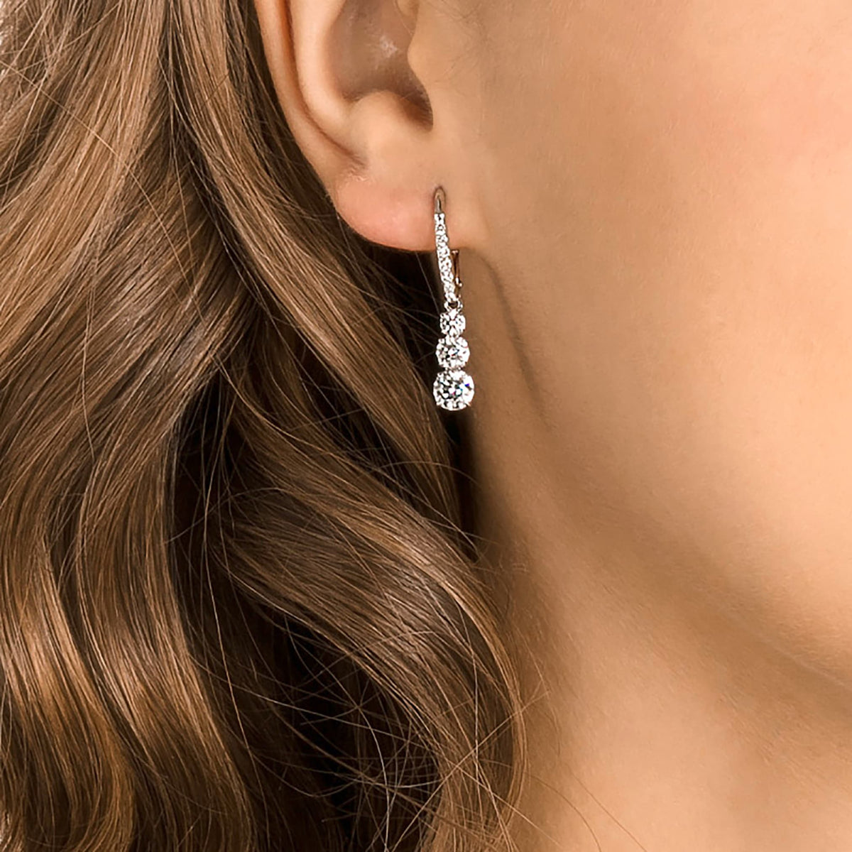 Swarovski Stilla Attract hoop earrings with white round-cut accents and rhodium plating