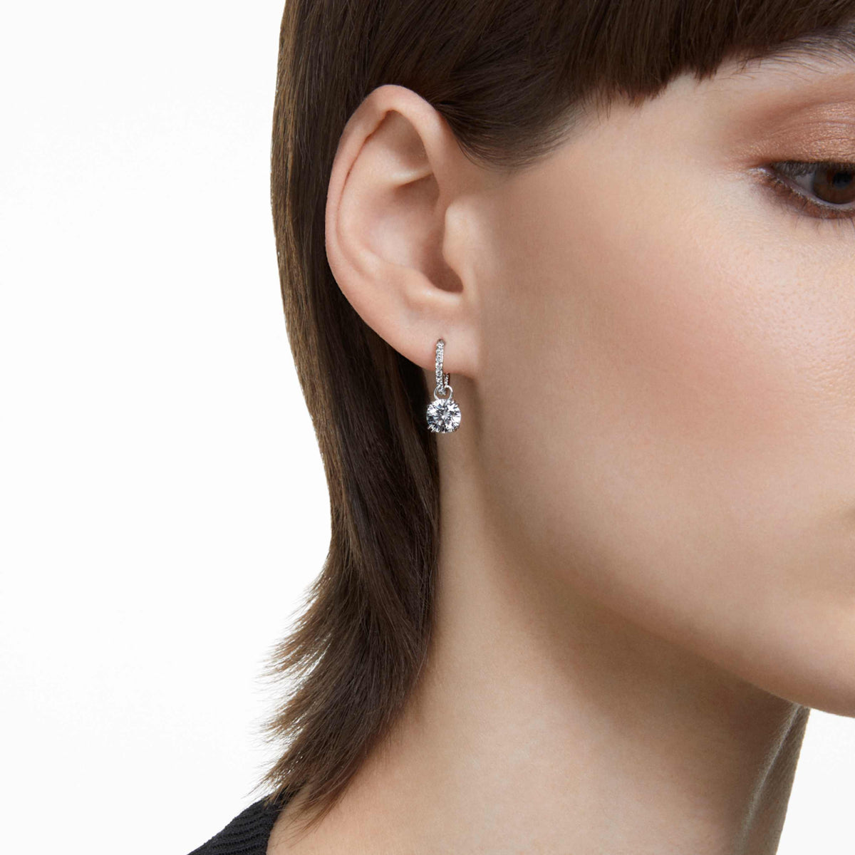 Swarovski Stilla drop earrings with white round-cut accents and an 18K gold finish