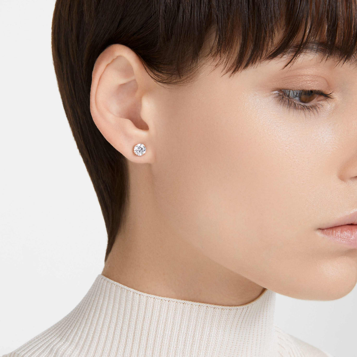 Swarovski Stilla stud earrings with white round-cut accents and rhodium plating