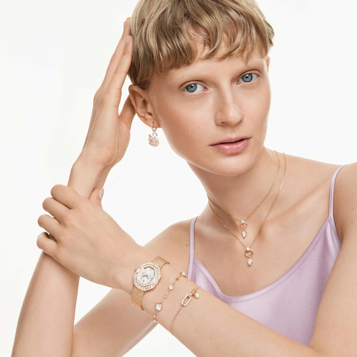Swarovski Swan drop earrings with pink pavé accents and an 18K rose gold finish