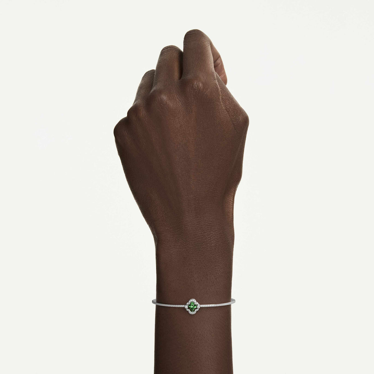Swarovski Una bangle featuring a clover motif with pink accents and an 18K rose gold finish